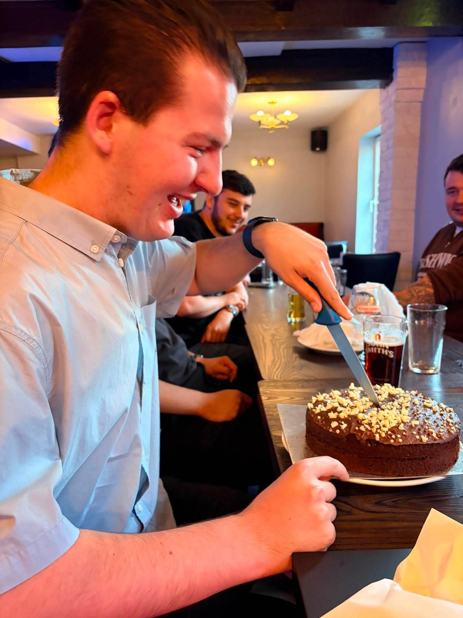 Damon Cutting Anniversary Cake 5